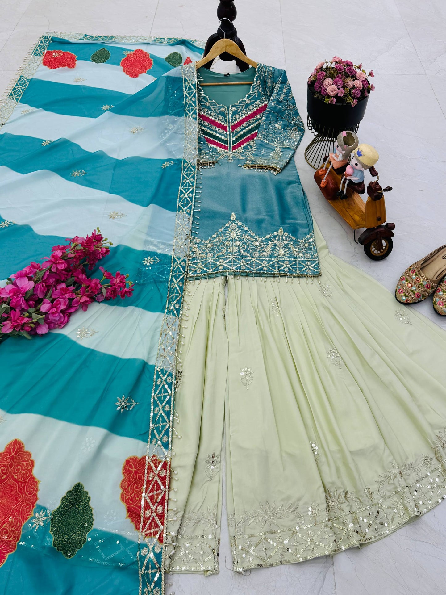 Sky Blue Color Top With Off White Sharara And Multi Color Dupatta